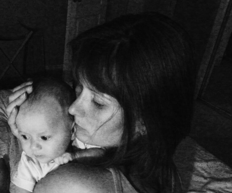 Mom holding awake baby during 4 month baby sleep regression