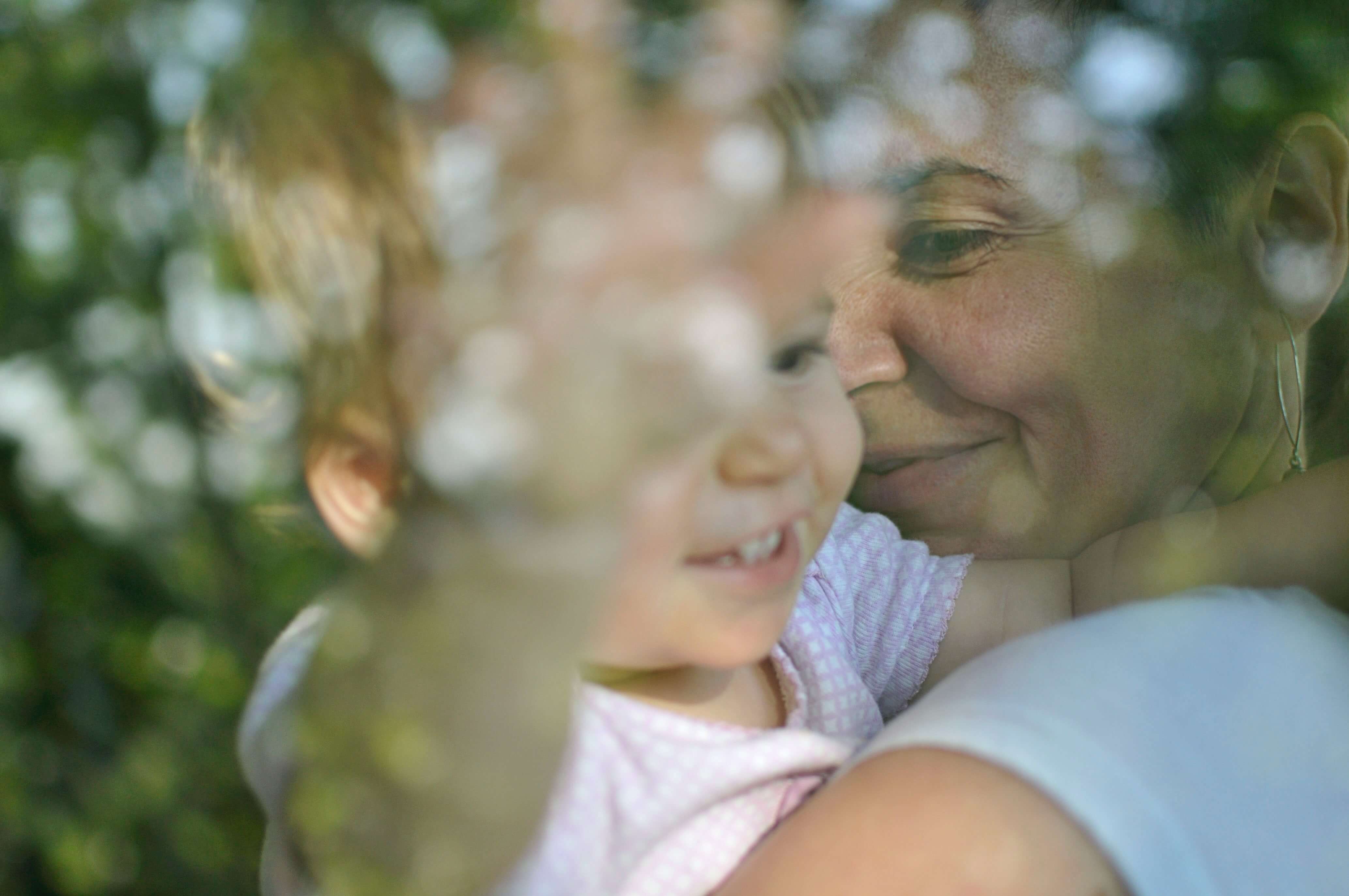 Mother holding smiling baby